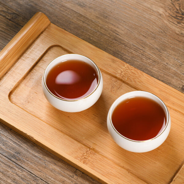 主图-3 云南西双版纳易武正山乔木野生茶饼357g熟茶大叶种晒青茶现货 Yunnan Xishuangbanna Yiwu Zhengshan Arbor Wild Tea Cake, 357g Ripe Tea, Large-leaf Sun-dried Green Tea, In Stock for Wholesale